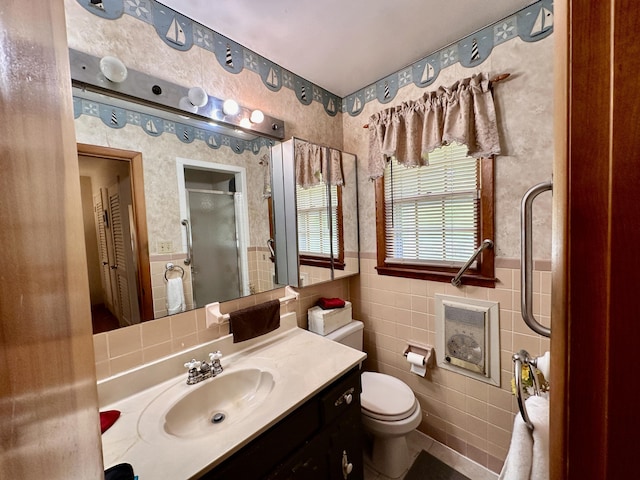 428 N Main St, Mckee, KY 40447 - bathroom featuring wallpapered walls, a shower with door, a wainscoted wall, tile walls, and toilet