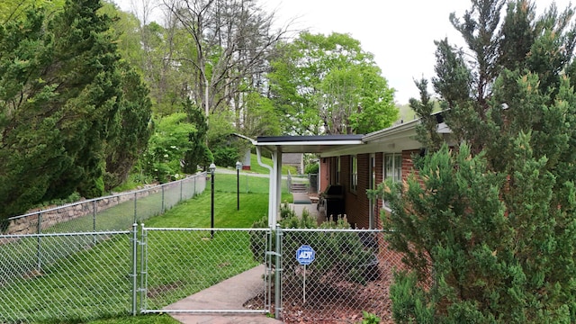 view of yard with fence private yard and a gate