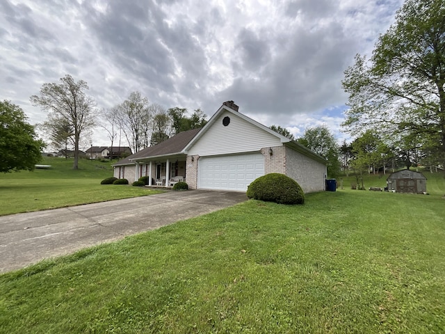 ranch-style house with a chimney, a front lawn, driveway, brick siding, and a garage