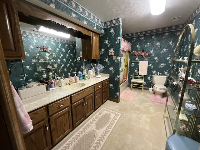 full bathroom featuring wallpapered walls, toilet, vanity, baseboards, and walk in shower