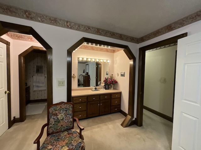 bathroom featuring vanity and baseboards