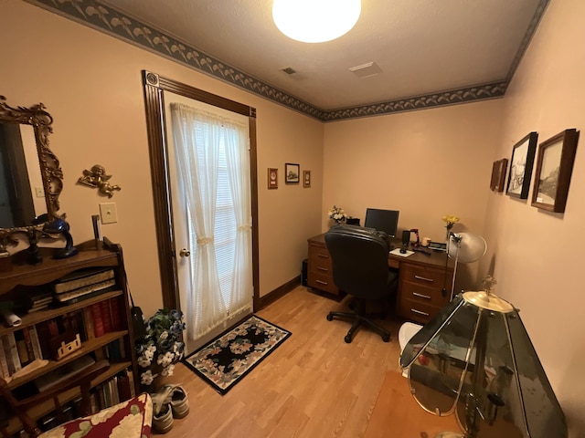 office area featuring light wood-style flooring and baseboards