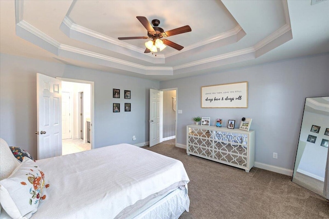 carpeted bedroom with a ceiling fan, baseboards, ornamental molding, and a raised ceiling