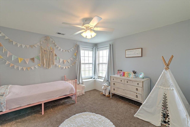 carpeted bedroom featuring ceiling fan and visible vents