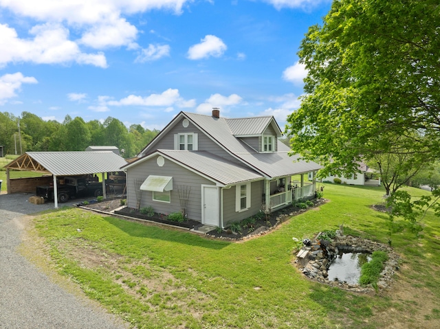 3576 Elkhorn Rd, Campbellsville, KY 42718 - view of property exterior featuring a chimney, metal roof, a lawn, a detached carport, and gravel driveway