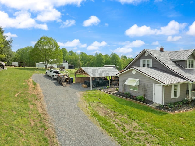 3576 Elkhorn Rd, Campbellsville, KY 42718 - view of front of home featuring metal roof, a front lawn, a detached carport, and gravel driveway