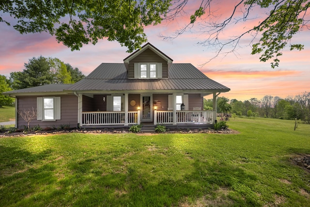 3576 Elkhorn Rd, Campbellsville, KY 42718 - view of front of house with covered porch, metal roof, and a front lawn