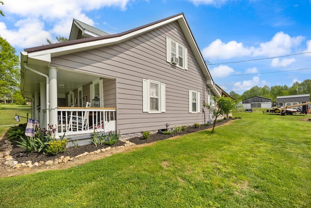 3576 Elkhorn Rd, Campbellsville, KY 42718 - view of property exterior with a porch, a yard, and cooling unit