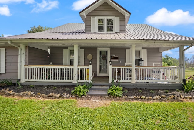 3576 Elkhorn Rd, Campbellsville, KY 42718 - farmhouse-style home with a porch, a front lawn, and metal roof