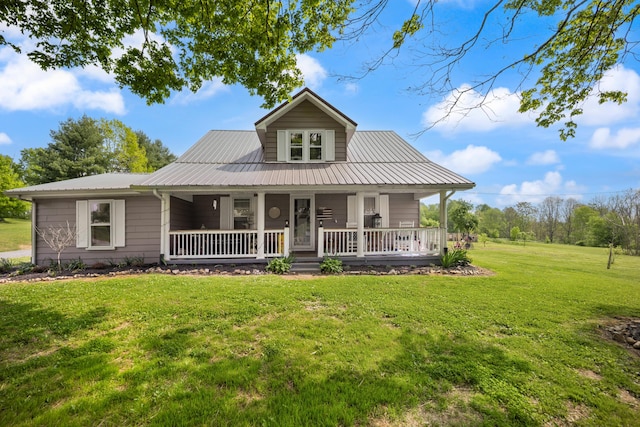 3576 Elkhorn Rd, Campbellsville, KY 42718 - farmhouse featuring covered porch, metal roof, and a front lawn