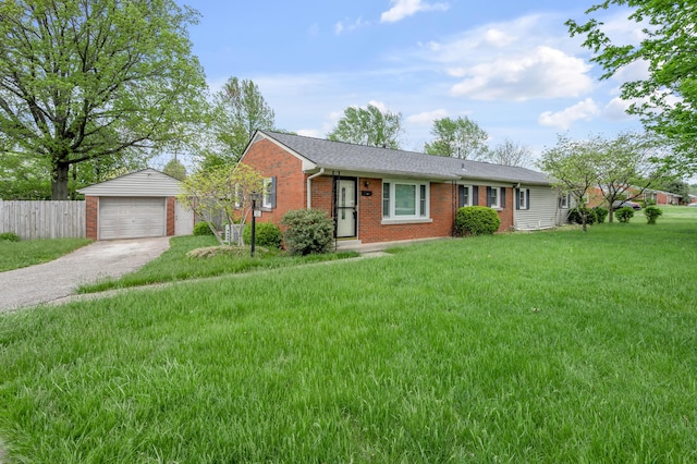 ranch-style house with brick siding, fence, an outbuilding, driveway, and a front yard