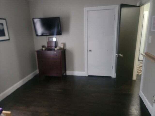 121 Hill Ct, Lancaster, KY 40444 - bedroom with dark wood-type flooring and baseboards
