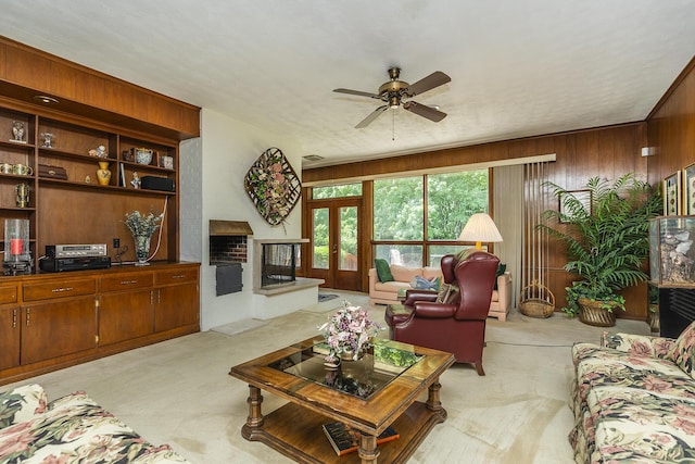 1964 Shadybrook Ln, Lexington, KY 40502 - carpeted living room with a brick fireplace, a ceiling fan, and wood walls