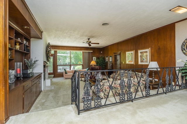 1964 Shadybrook Ln, Lexington, KY 40502 - living area featuring light carpet, wood walls, and ceiling fan