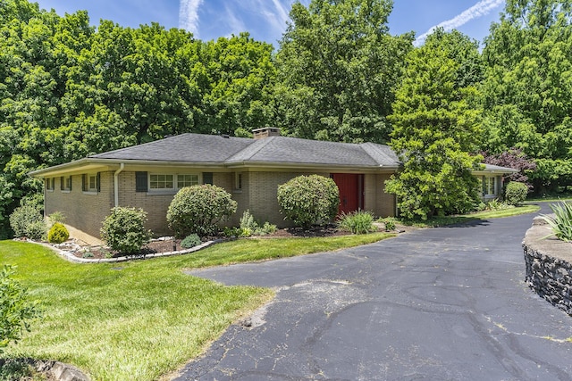 1964 Shadybrook Ln, Lexington, KY 40502 - view of front of home with brick siding, a front lawn, and a chimney