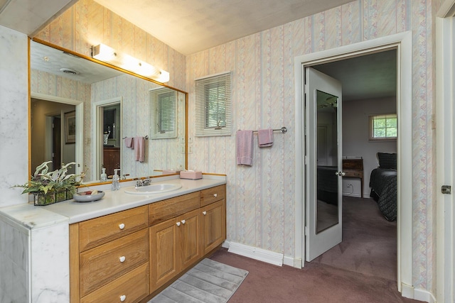 1964 Shadybrook Ln, Lexington, KY 40502 - bathroom with baseboards, vanity, and wallpapered walls