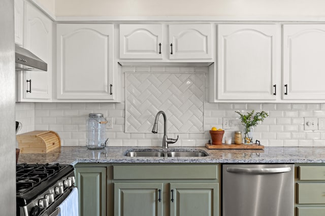 kitchen featuring a sink, white cabinets, wall chimney range hood, and stainless steel appliances