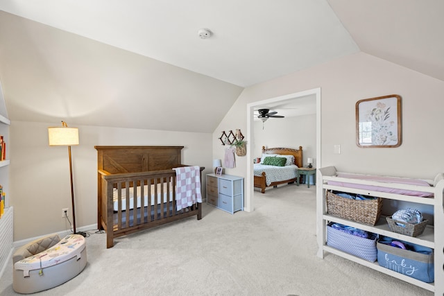 bedroom with carpet and lofted ceiling