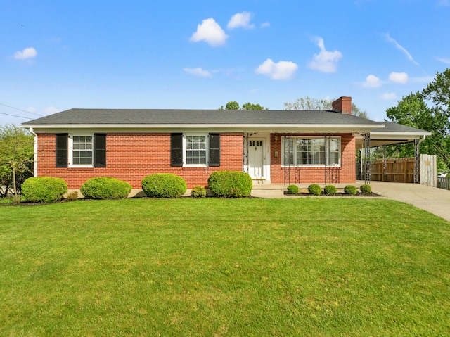 307 N Doctor St, Springfield, KY 40069 - ranch-style home with concrete driveway, a front lawn, and brick siding