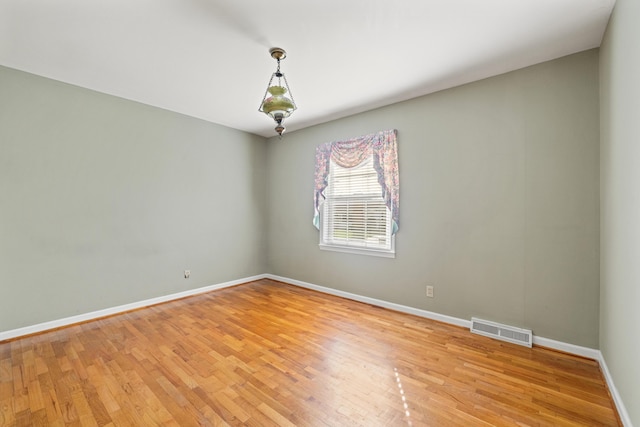 307 N Doctor St, Springfield, KY 40069 - spare room with visible vents, light wood finished floors, and baseboards