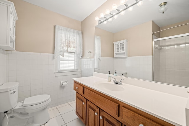 307 N Doctor St, Springfield, KY 40069 - bathroom with tile walls, vanity, toilet, tile patterned flooring, and wainscoting