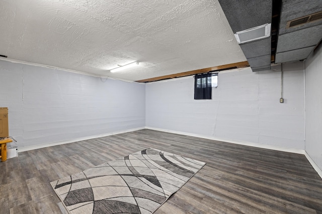 307 N Doctor St, Springfield, KY 40069 - below grade area with a textured ceiling, visible vents, wood finished floors, and baseboards