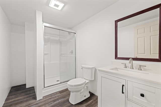 307 N Doctor St, Springfield, KY 40069 - bathroom with vanity, wood finished floors, toilet, and a stall shower