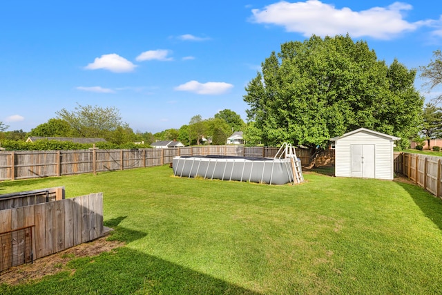 307 N Doctor St, Springfield, KY 40069 - view of yard with an outdoor structure, a shed, a fenced in pool, and a fenced backyard
