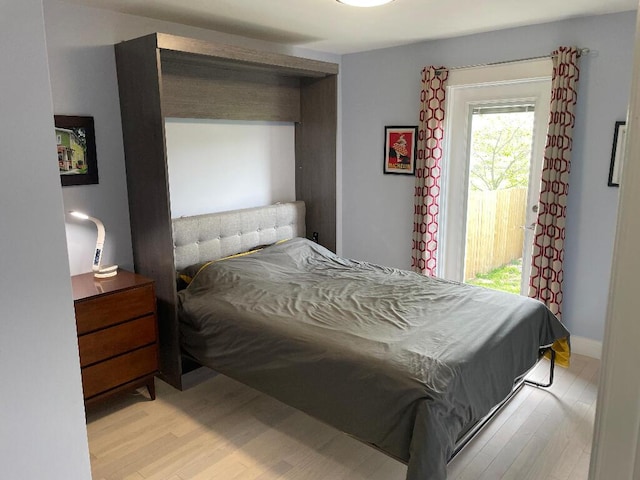 bedroom with light wood finished floors