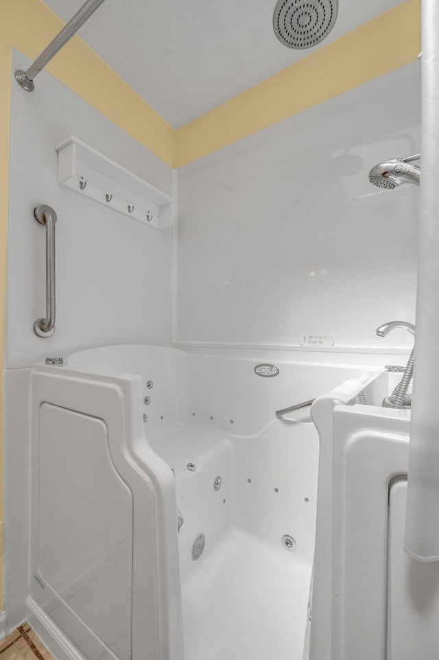 bathroom featuring a shower and a jetted tub