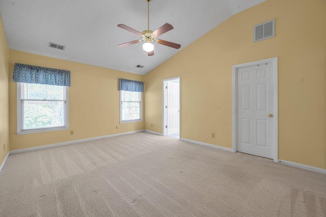 unfurnished room with baseboards, visible vents, ceiling fan, and light colored carpet