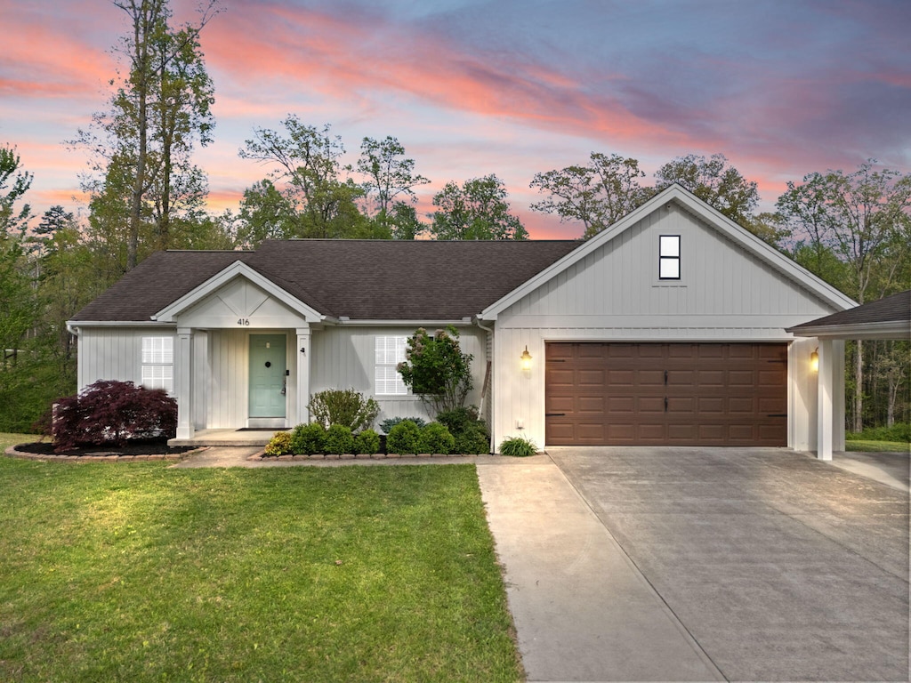 416 Scarlet Oak Dr, London, KY 40741 - view of front of home featuring driveway, a garage, and a front lawn