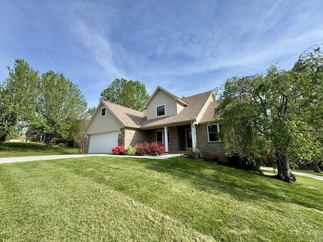 view of front of home with an attached garage, concrete driveway, a front yard, and brick siding
