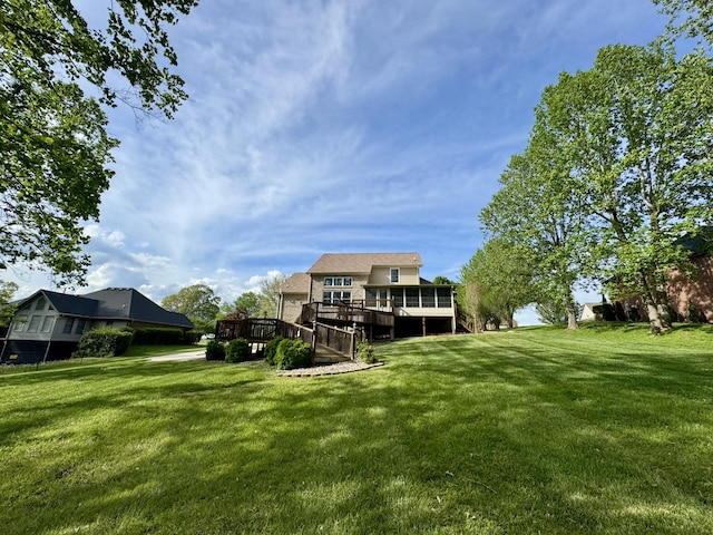 view of yard with a wooden deck