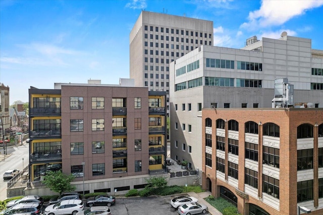 121 N Martin Luther King Blvd Unit 401, Lexington, KY 40508 - view of building exterior with uncovered parking and a city view