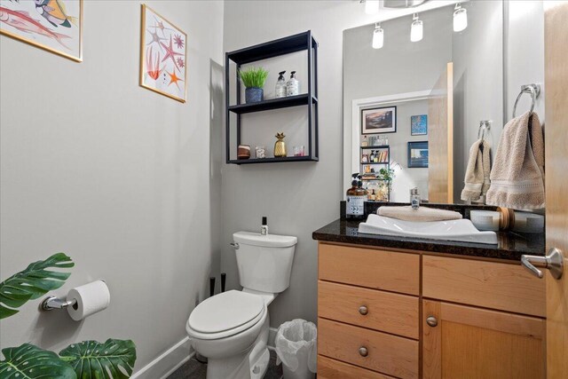 121 N Martin Luther King Blvd Unit 401, Lexington, KY 40508 - half bath with vanity, toilet, and baseboards