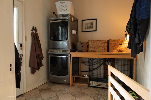 1770 Millersburg-Cynthiana Rd, Paris, KY 40361 - laundry room featuring stacked washer / dryer, tile patterned flooring, laundry area, and baseboards