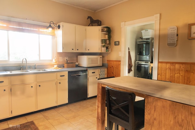 1770 Millersburg-Cynthiana Rd, Paris, KY 40361 - kitchen featuring a sink, stacked washer and clothes dryer, black dishwasher, white microwave, and wainscoting