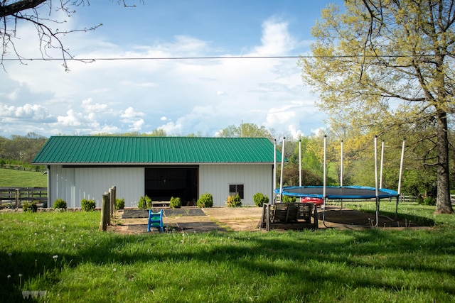 1770 Millersburg-Cynthiana Rd, Paris, KY 40361 - view of pole building featuring a trampoline, fence, and a lawn