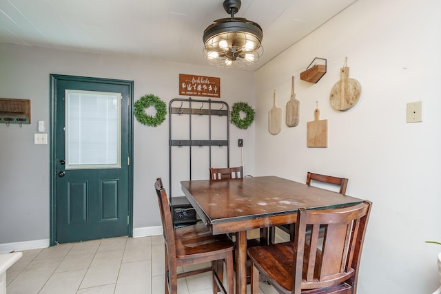 1139 Venetian Way, Lexington, KY 40517 - dining space featuring light tile patterned flooring, baseboards, and a chandelier