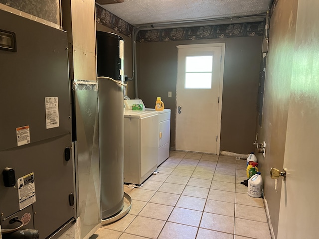 513 Sharp Gap Rd, Barbourville, KY 40906 - laundry area with independent washer and dryer, light tile patterned floors, heating unit, laundry area, and a textured ceiling