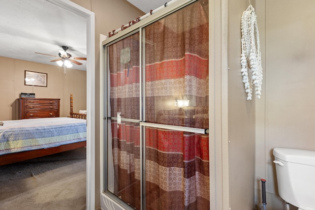 12739 Stulltown Rd, Hope, KY 40334 - full bath with toilet, ceiling fan, ensuite bathroom, and a shower stall