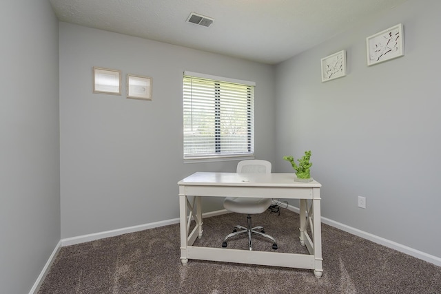 office with baseboards, visible vents, and carpet