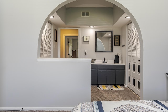 bathroom featuring visible vents, vanity, and recessed lighting