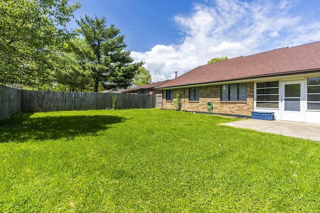 view of yard with a fenced backyard and a patio area