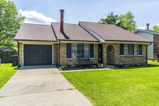 view of front of home featuring a front lawn, driveway, an attached garage, and brick siding