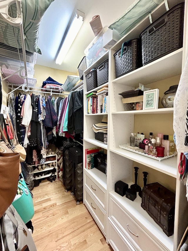 spacious closet with light wood-style flooring