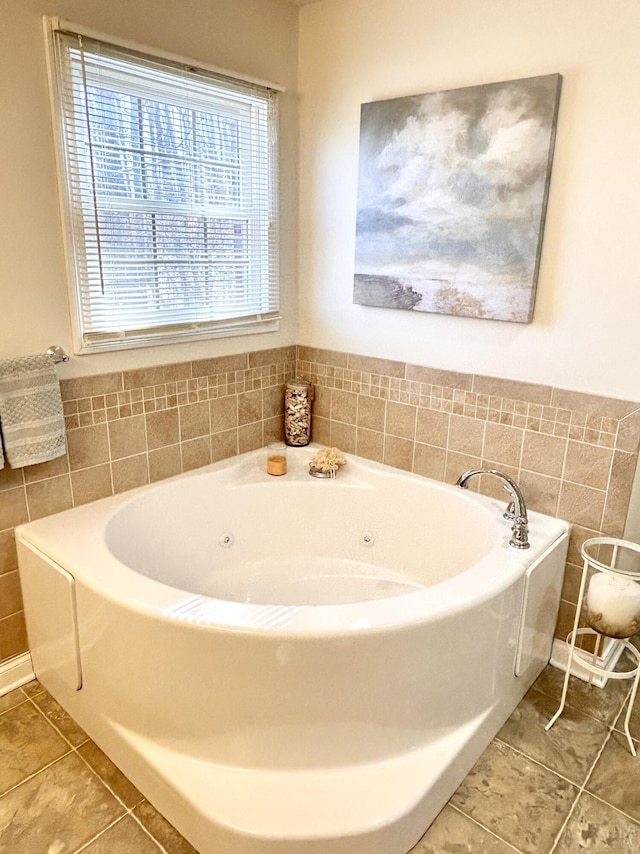 full bath with a bath and tile patterned flooring