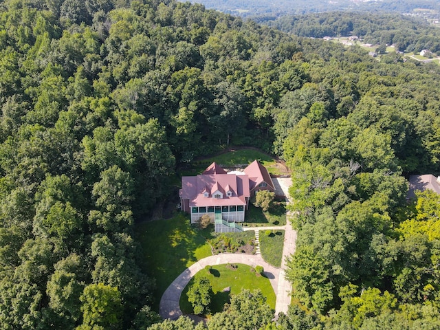 aerial view featuring a wooded view
