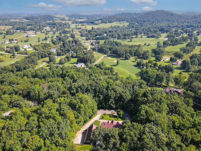 birds eye view of property featuring a forest view